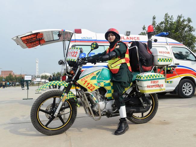 Pakistani first responder Samra Akram Zia with her motorcycle ambulance service during a passing out ceremony in Lahore. Picture: AFP