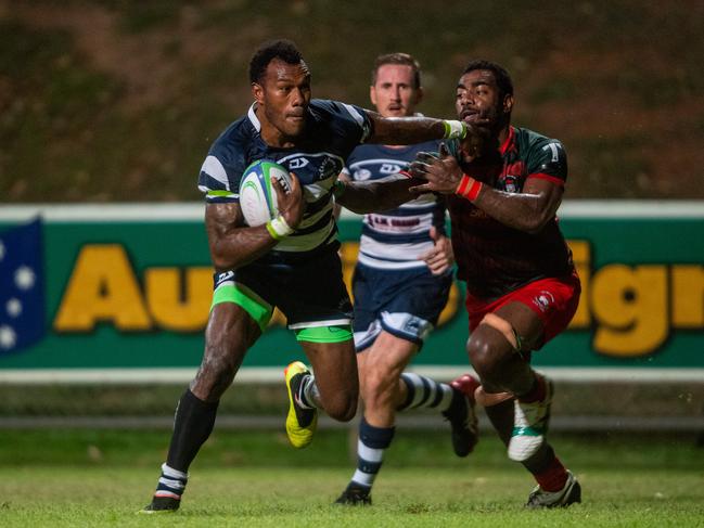 Casuarina Cougars Suliasi Tavodi on the run against South Darwin. Picture: Che Chorley