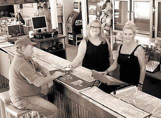 FRIENDLY PUB: Venue manager Donna Ferguson and duty manager Cheryl Birmingham serve a loyal customer at the bar. Picture: Contributed