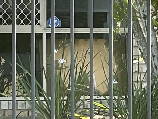 A shattered front window at the Upper Coomera home where it's understood the confrontation took place. Picture: Supplied.