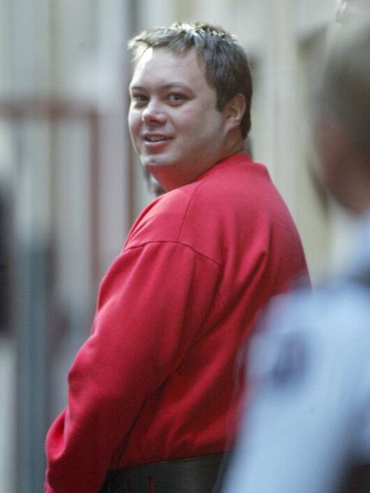 Carl Williams is taken from Melbourne Supreme Court after a drug trafficking hearing in 2004.