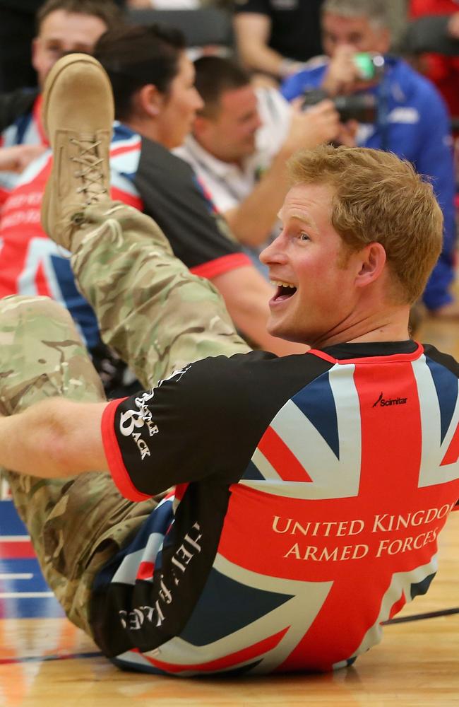 Prince Harry plays for the UK team against the USA during a seated vollyball exhibition match during the Warrior Games in Colorado, May 2013. The experience would be life-changing for many - including the prince himself. Picture:  Chris Jackson/Getty Images