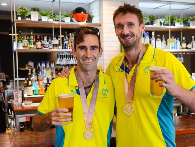 Beach volleyballers Chris McHugh and Damien Schumann, Tuesday, April 24, 2018. They were long-time rivals and are now teammates who won gold at the Comm Games. (AAP Image/ Brenton Edwards)