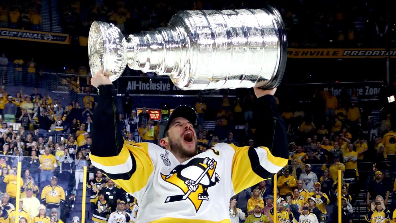 Sidney Crosby of the Pittsburgh Penguins celebrates with the Stanley Cup Trophy. (Photo by Bruce Bennett/Getty Images)