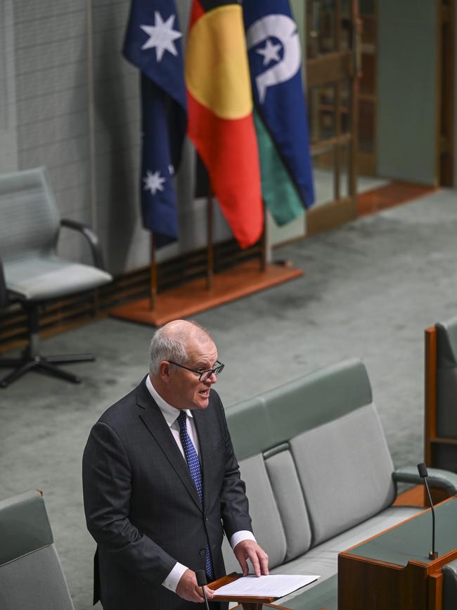 Mr Morrison, pictured with the Australian, Aboriginal and Torres Strait Islander flags as he delivers his speech on the voice. Picture: NCA NewsWire / Martin Ollman