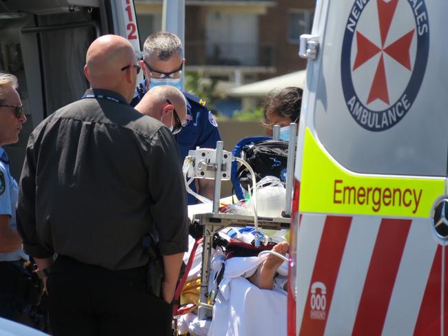 Paramedics working on Daniel Bolton after he was involved in a shooting with police. He later died Picture: Richard Noone