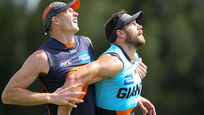 Sam Jacobs competes with Shane Mumford at training. Picture: Jason McCawley/Getty Images