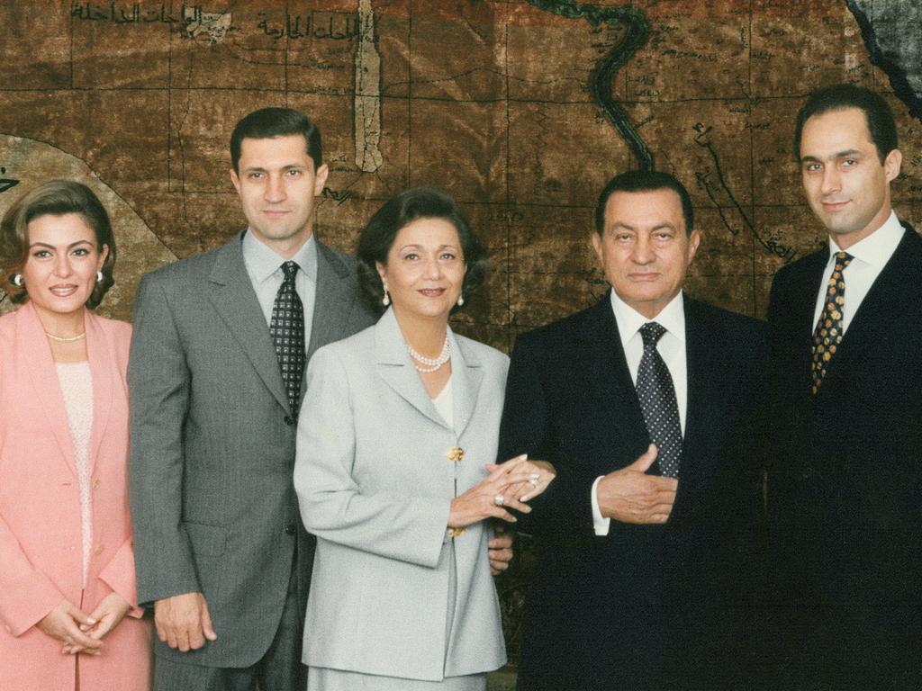 Former President Hosni Mubarak (2nd-R) posing with his wife Suzanne (C), accompanied by their two sons Gamal (R) and Alaa (2nd-L) with his wife Heidi al-Rasekh (L) in the Tahadeya Palace in Cairo. Picture: AFP