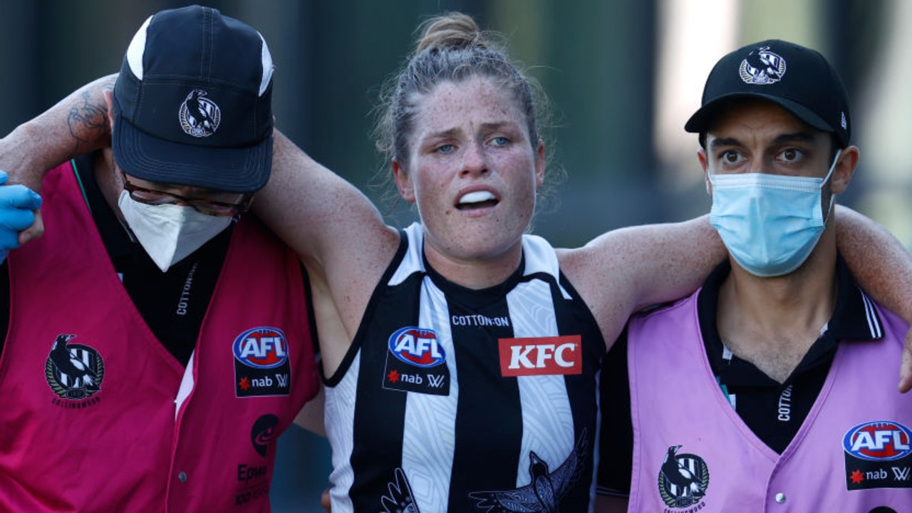MELBOURNE, AUSTRALIA - JANUARY 09: Brianna Davey of the Magpies leaves the field injured during the 2022 AFLW Round 01 match between the Carlton Blues and the Collingwood Magpies at Ikon Park on January 9, 2022 in Melbourne, Australia. (Photo by Michael Willson/AFL Photos via Getty Images)
