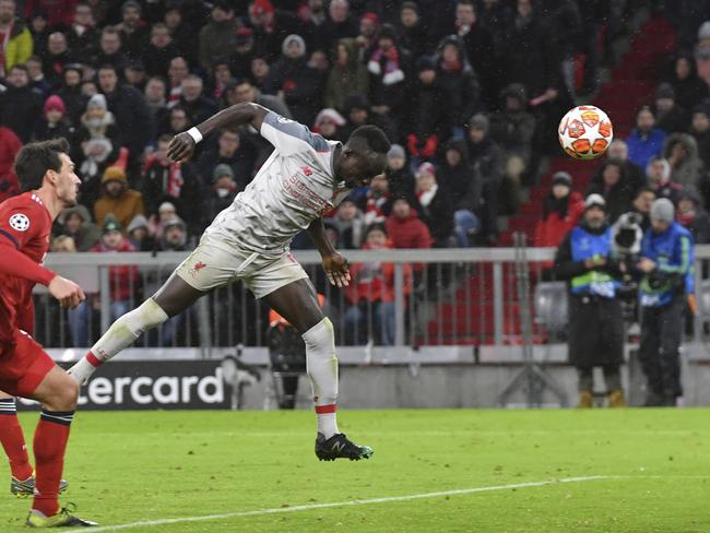 Liverpool midfielder Sadio Mane, second left, scores his side's third goal during the Champions League round of 16 second leg soccer match between Bayern Munich and Liverpool at the Allianz Arena, in Munich, Germany, Wednesday, March 13, 2019. (AP Photo/Kerstin Joensson)