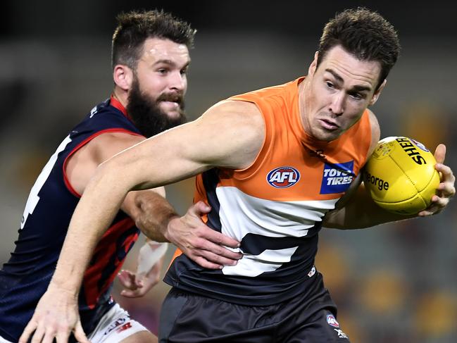 BRISBANE, AUSTRALIA - SEPTEMBER 12: Jeremy Cameron of the Giants is tackled during the round 17 AFL match between the Greater Western Sydney Giants and the Melbourne Demons at The Gabba on September 12, 2020 in Brisbane, Australia. (Photo by Albert Perez/Getty Images)