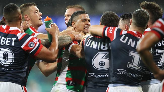 Cody Walker scuffles with the Roosters.