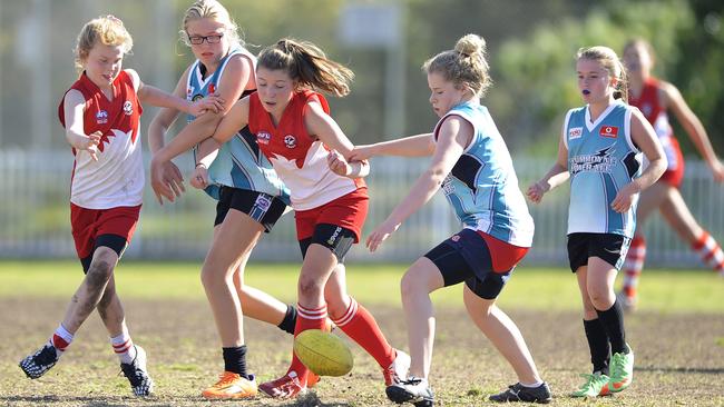 Mosman Swans and Drummoyne AFL players compete on Middle Head Oval in 2014.