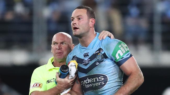 Allan Langer helps Boyd Cordner after a heavy knock during game two. Picture: Brett Costello