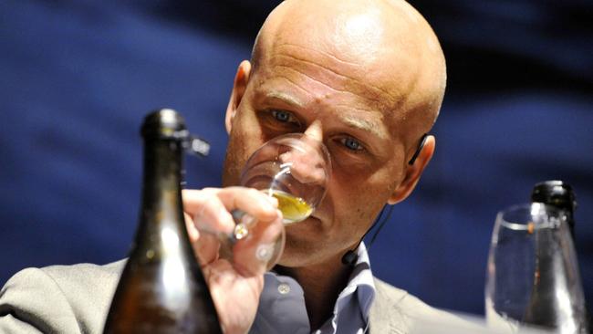 The world's leading champagne expert Richard Juhlin sampling one of the 168 bottles of champagne salvaged from a 200-year-old shipwreck in the waters off Aland Islands in 2010. Picture: AP Photo/Lehtikuva/Jussi Nukari