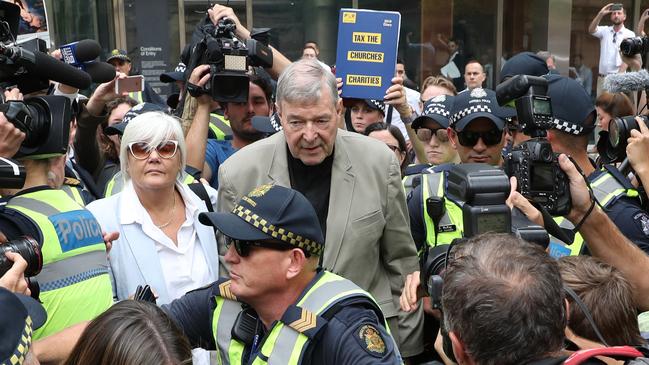 Sexual abuse victims and their advocates have spewed abuse at Cardinal George Pell outside court. Picture: AAP Image/David Crosling