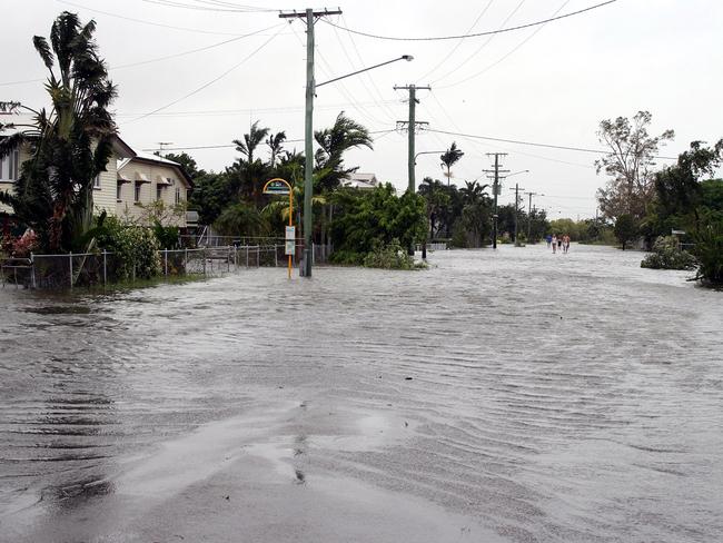 A Townsville street is inundated with floodwater after Cyclone Yasi. Picture: AAP Image/Carly Lubicz