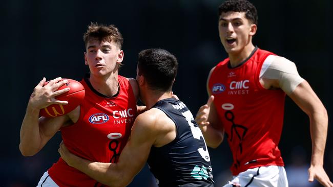 MELBOURNE, AUSTRALIA - FEBRUARY 22: Hugh Boxshall of the Saints is tackled by Adam Cerra of the Blues during the 2025 AFL match simulation between the Carlton Blues and St Kilda Saints at Ikon Park on February 22, 2025 in Melbourne, Australia. (Photo by Michael Willson/AFL Photos via Getty Images)