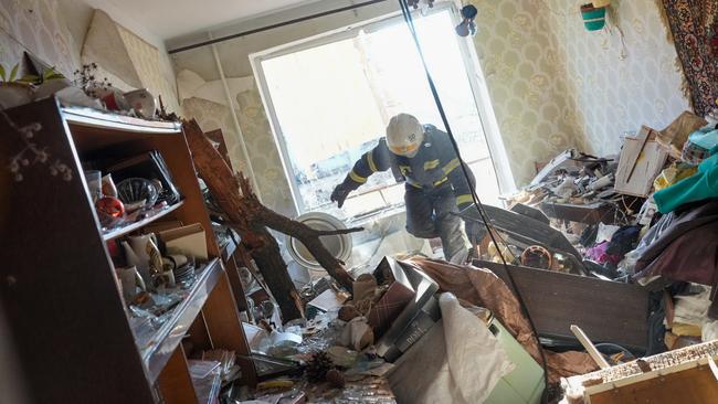 Ukrainian firefighters arrive to rescue civilians after an airstrike hit an apartment complex in Chuhuiv, Kharkiv Oblast. Picture: Getty Images