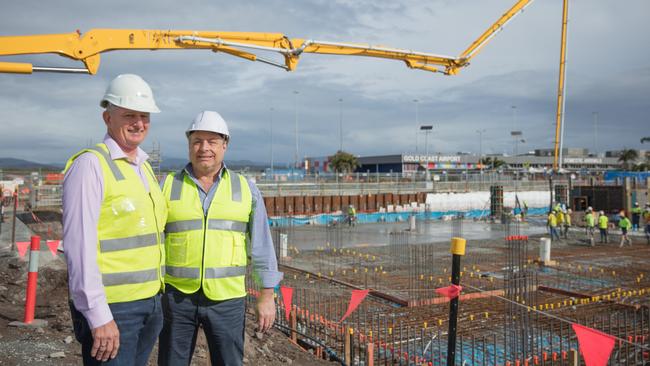 Condev Construction managing director Steve Marais (left) and Queensland Airports Limited executive general manager property and infrastructure Carl Bruhn in front of the slab now laid for the Gold Coast Airport's first hotel, a $50 million Rydges scheduled to open mid-2020. PICTURE: Fotomedia