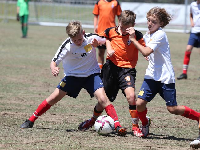 The Premier Invitational football tournament on the Gold Coast. Brisbane Roar Orange v TFC Brisbane White under-13s in action. Picture: Mike Batterham.