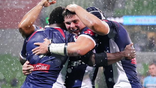 Rebels players celebrate after a try scored by Marika Koroibete during the Round 3 Super Rugby match between the Melbourne Rebels and NSW Waratahs at AAMI Park in Melbourne, Friday, February 14, 2020. (AAP Image/Scott Barbour) NO ARCHIVING, EDITORIAL USE ONLY