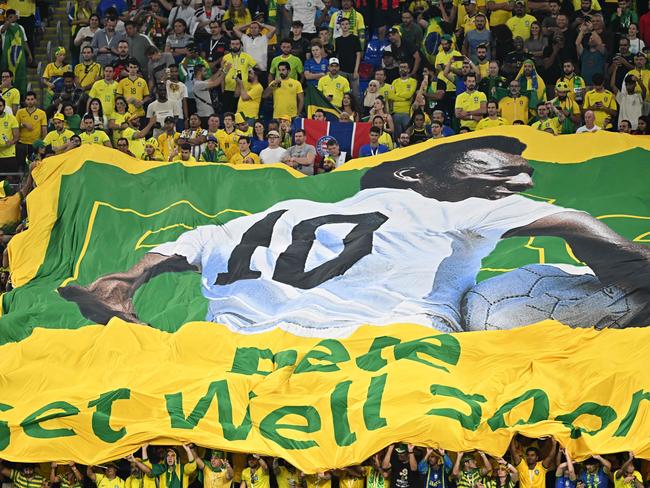 Brazil supporters display a banner depicting Brazilian football legend Pele and reading "Pele, get well soon" during the Qatar 2022 World Cup round of 16 football match between Brazil and South Korea. Picture: Manan Vatsyayana/AFP