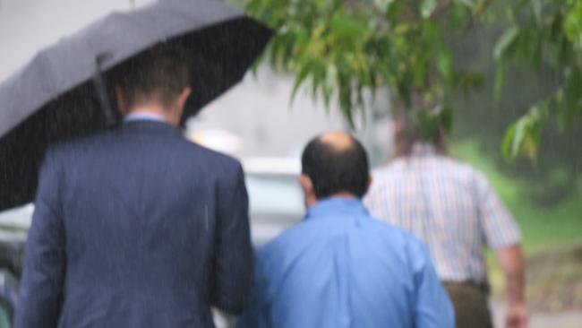 Doctor Fady Malak, 38, of Erina (blue shirt) leaving Gosford Local Court after his first appearance.