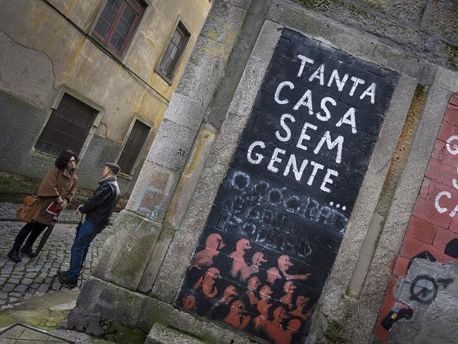 Margarida Castro Felga guides US tourist Dean Watson through central Porto. Picture: AFP