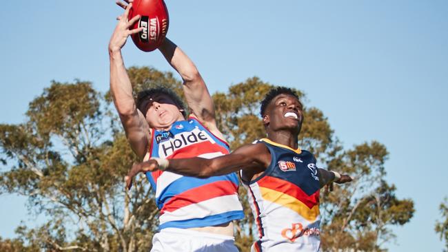 Central's Cooper Dahms marks over Adelaide's Aron Asfaha at Elizabeth Oval last year. Picture: AAP Image/MATT LOXTON