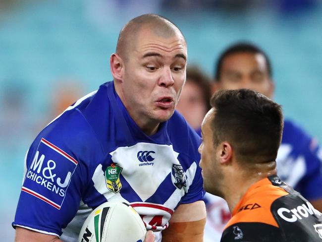 SYDNEY, AUSTRALIA - JULY 27:  Luke Brooks of the Tigers tackles David Klemmer of the Bulldogs during the round 20 NRL match between the Canterbury Bulldogs and the Wests Tigers at ANZ Stadium on July 27, 2018 in Sydney, Australia.  (Photo by Cameron Spencer/Getty Images)