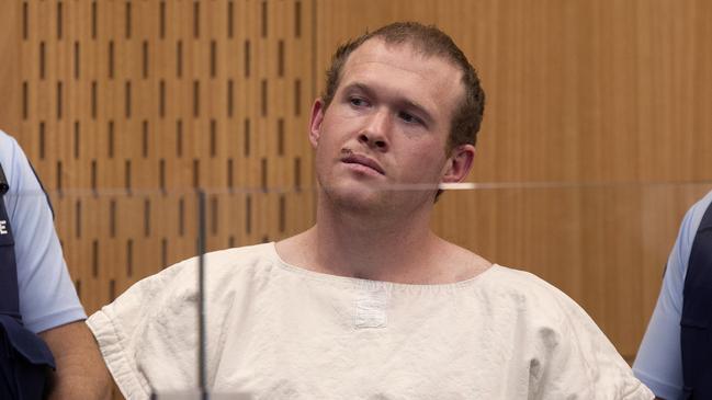 FILE - In this March 16, 2019, file photo, Brenton Tarrant, the man charged in the Christchurch mosque shootings, appears in the Christchurch District Court, in Christchurch, New Zealand. The man accused of killing 51 people at two Christchurch mosques on Friday, June 14, 2019, pleaded not guilty to all the charges filed against him. (AP Photo/Mark Mitchell, Pool, File)