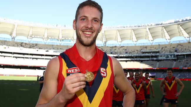 BIG LOSS: Former South Adelaide ruckman Michael Knoll with the Fos Williams Medal he won as SA’s best player against WA. Picture: PAUL KANE (Getty Images).