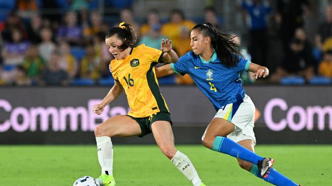 Hayley Raso of Australia is challenged by Lauren of Brazil during the International Friendly match between the Matildas and Brazil at Cbus Super Stadium on December 01, 2024 in Gold Coast, Australia. Photo by Bradley Kanaris/Getty Images