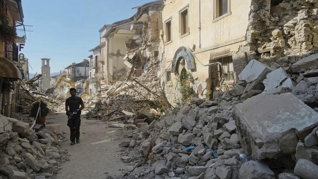 A man walks in a street in Amatrice, central Italy, where a 6.2 earthquake struck just after 3:30am, on August 24, 2016. Picture: Emilio Fraile.