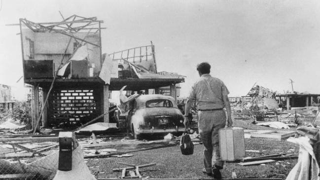 1974. So this is home. Mr Jeff Casey returns from holidays, suitcase in hand, to his home in the Darwin suburb of Casuarina.[The Herald, 27 December, 1974, Page 1] .Home owner returning to his house destroyed by Cyclone Tracy in Darwin, NT 1974. northern terittory  1970s/Storms/Australia