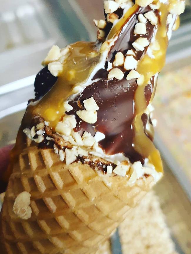 A chocolate-lined waffle cone with nuts and caramel from the Cone Queen.