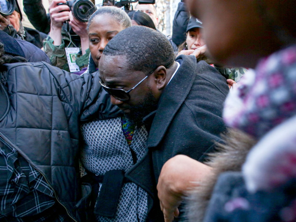 Michael Thomas, one of the correctional officers charged with falsifying records on the night Jeffrey Epstein died, leaves court.