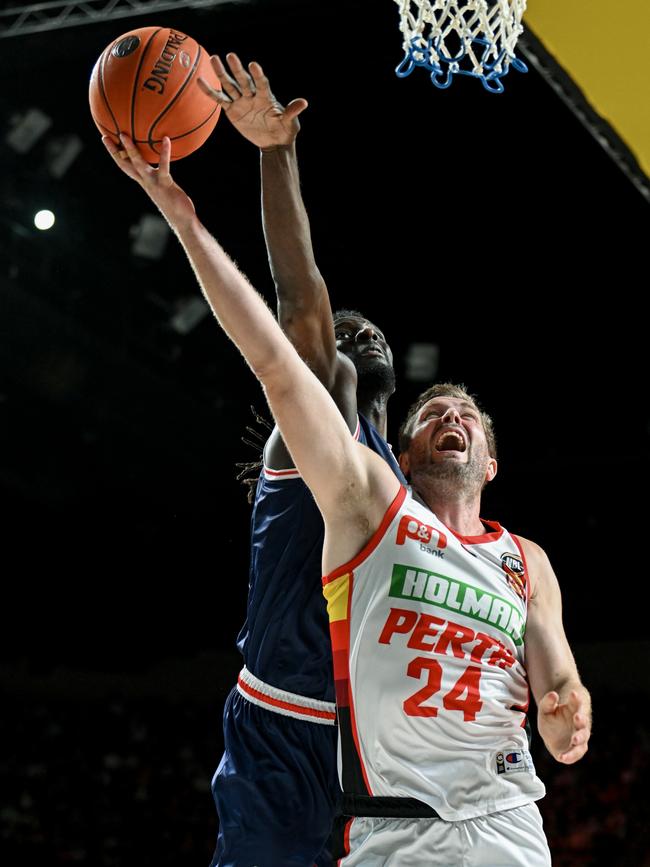 Desperation as Jesse Wagstaff of the Wildcats heads for the basket, defended by Alex Starling of the 36ers. Picture: Mark Brake/Getty Images.