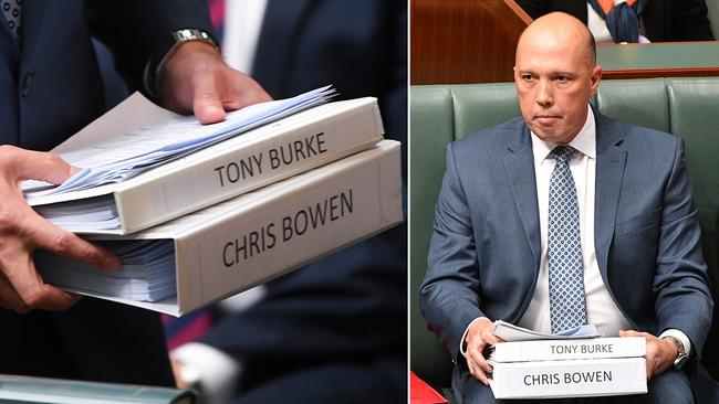 Peter Dutton brings his homework into the house yesterday.