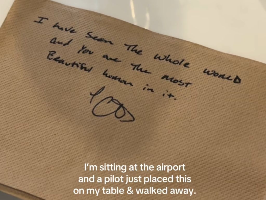 The woman received a handwritten note from a pilot.