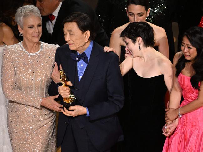 Jamie Lee Curtis and actor James Hong walk onstage after winning the Oscar for Best Picture for Everything Everywhere All at Once. Picture: AFP