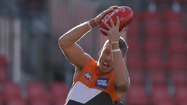 SYDNEY, AUSTRALIA - JUNE 14: Aidan Corr of the Giants wins the mark during the round 2 AFL match between the Greater Western Sydney Giants and the North Melbourne Kangaroos at GIANTS Stadium on June 14, 2020 in Sydney, Australia. (Photo by Mark Kolbe/Getty Images)