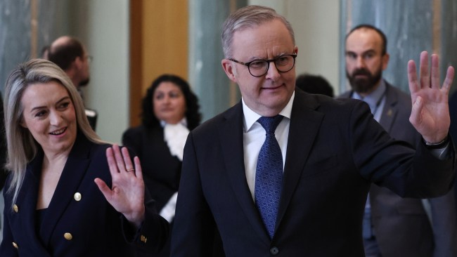 Prime Minister Anthony Albanese and his partner Jodie Haydon wave as Charles and Camilla visit Parliament House. Picture: David Gray - Pool/Getty Images