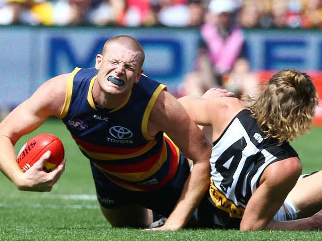 Sam Jacobs comes down badly in a contest with Aaron Young. Picture: Sarah Reed