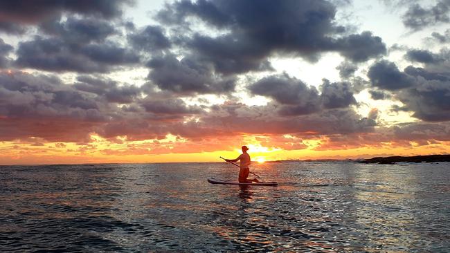 Sara Egan spotted a love heart in the clouds while paddle boarding one morning. She knew it was her dad looking down on her. Picture: supplied.