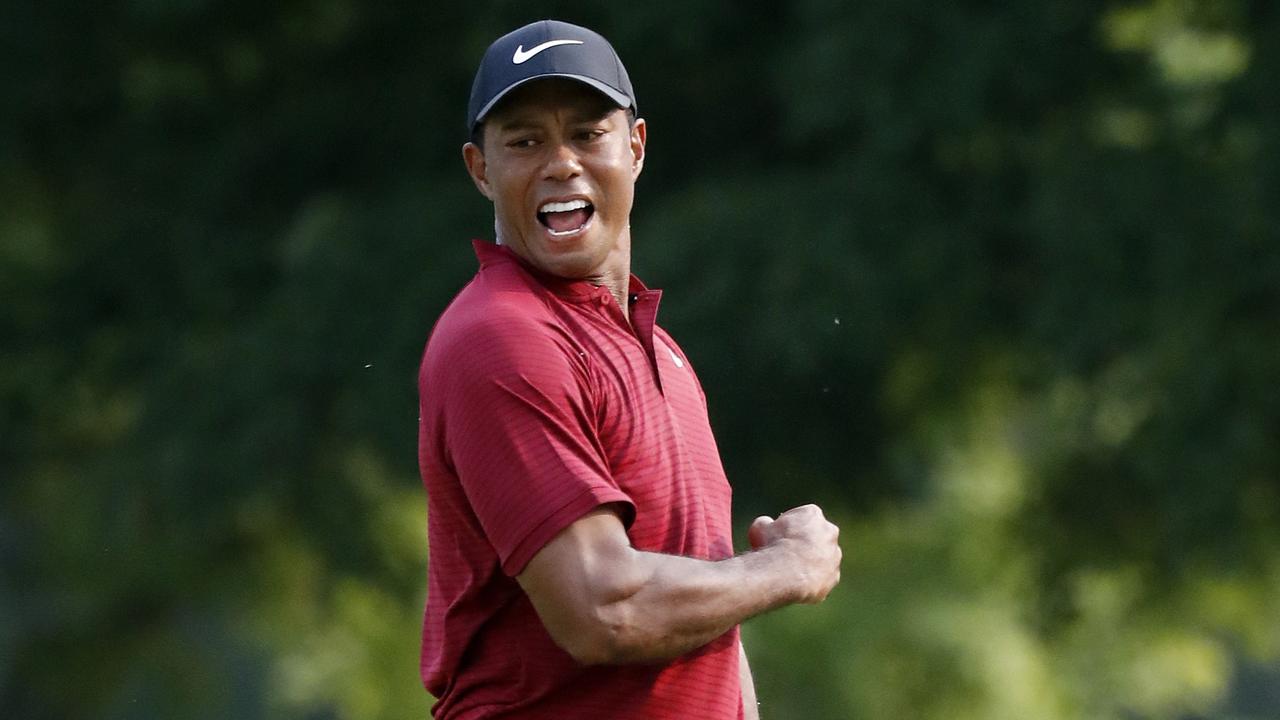 Tiger Woods celebrates after making a birdie putt on the 18th green during the final round of the PGA Championship. Picture: AP