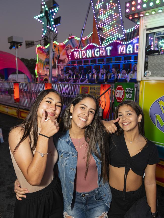 Ready to ride the Midnight Madness show ride are (from left) Heloisa Da Silva, Giovana Alves and Marianna De Paula at the Toowoomba Royal Show, Thursday, March 30, 2023. Picture: Kevin Farmer