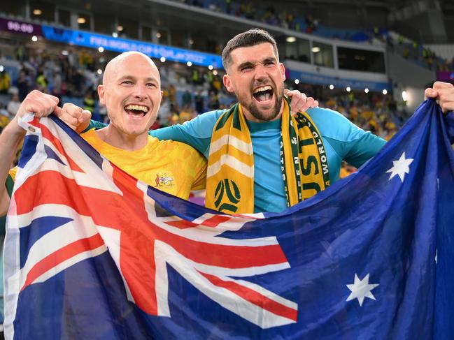 AL WAKRAH, QATAR - NOVEMBER 30: Aaron Mooy (L) and Mathew Ryan of Australia celebrate after the 1-0 win during the FIFA World Cup Qatar 2022 Group D match between Australia and Denmark at Al Janoub Stadium on November 30, 2022 in Al Wakrah, Qatar. (Photo by Shaun Botterill - FIFA/FIFA via Getty Images)