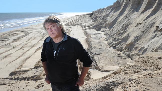 Coastal ecologist Ian Dyson at West Beach, looking north towards Henley Beach. Erosion from storm damage caused this winter is visible.